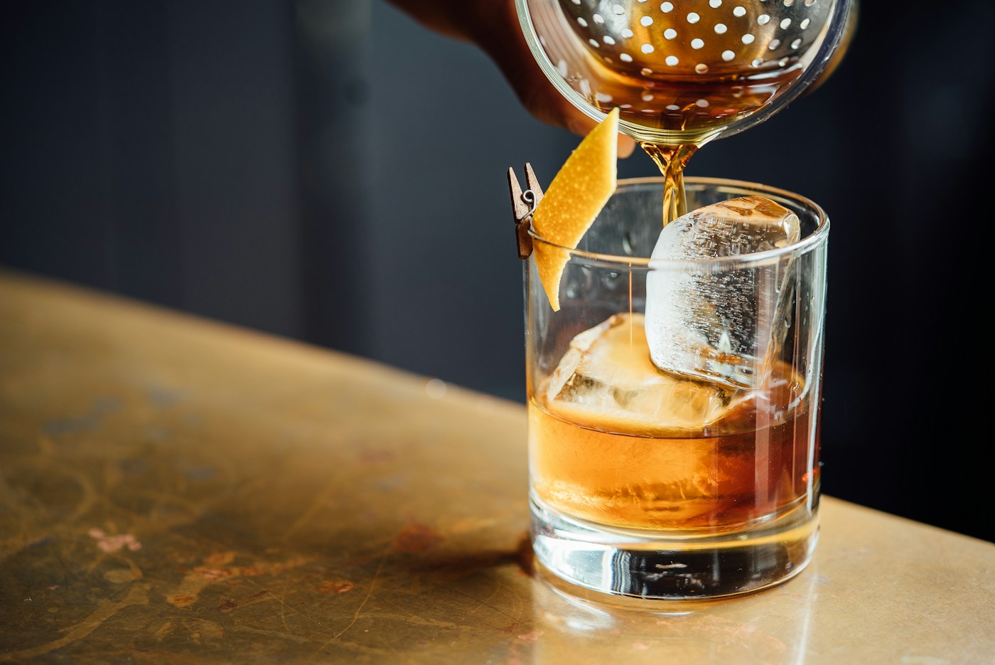 A citrus cocktail in warm amber light